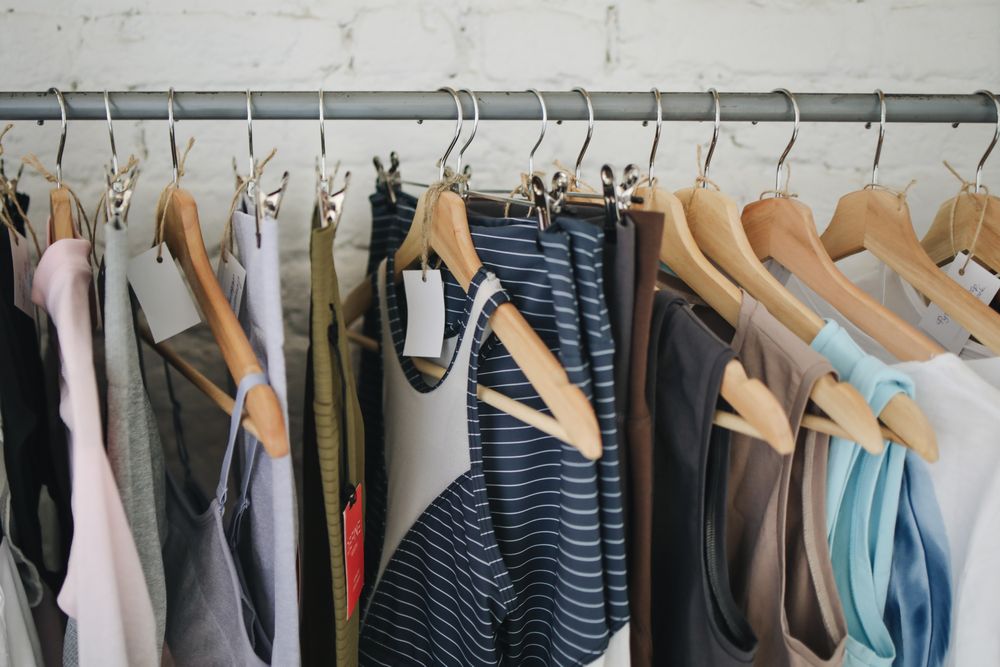 A considered selection of clothes in a wardrobe